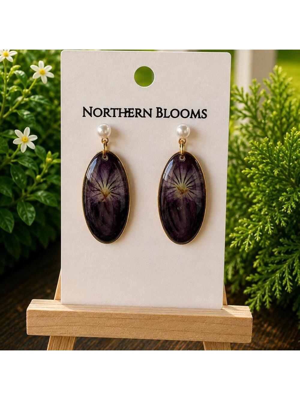 Pressed violet earrings in gold setting with faux pearl accents
